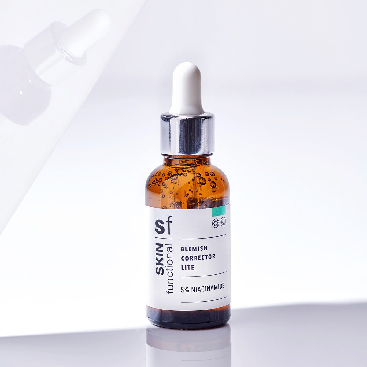 SKIN Functional Blemish Corrector Lite with details skincare product on a light gray background
