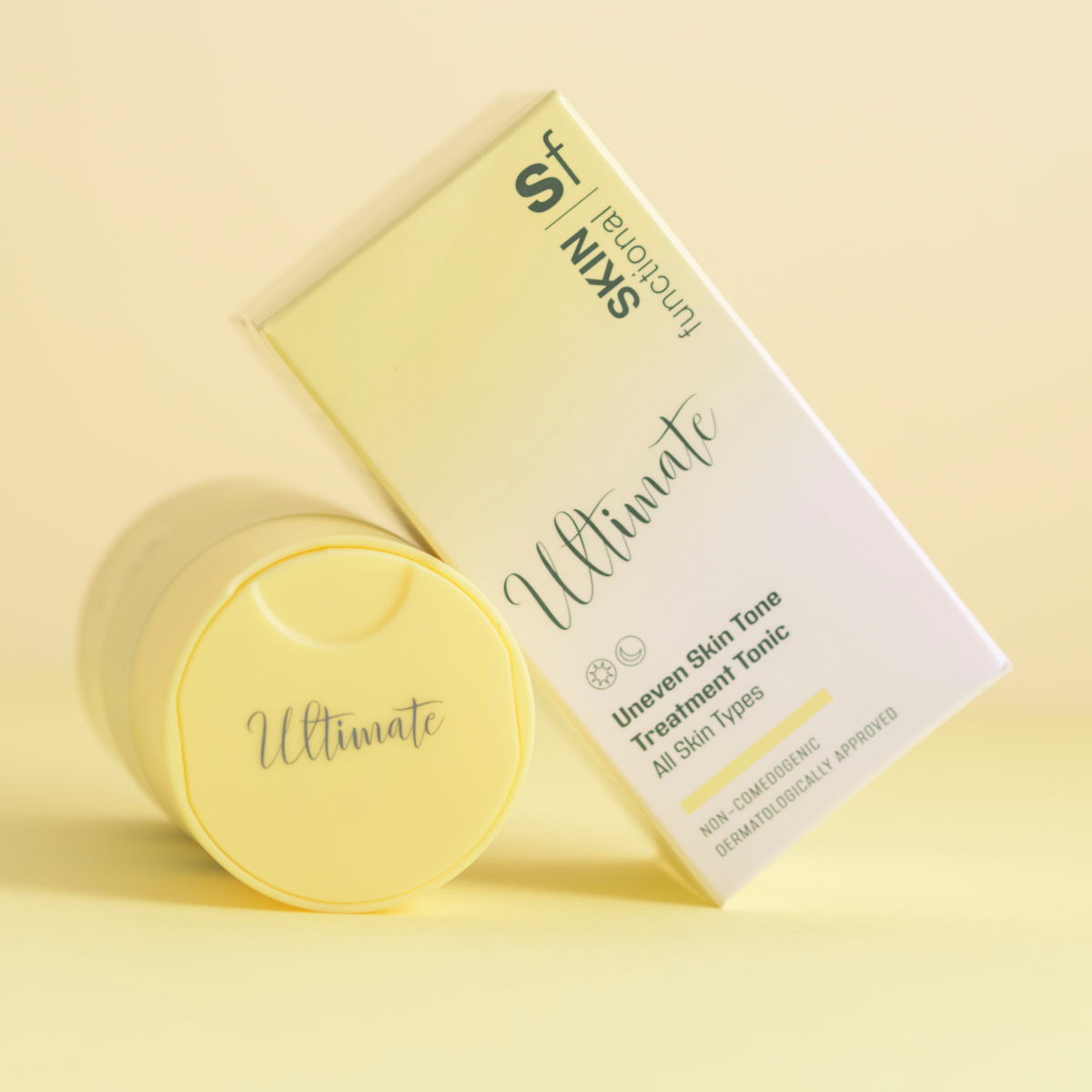 Yellow skincare product and box on a yellow background