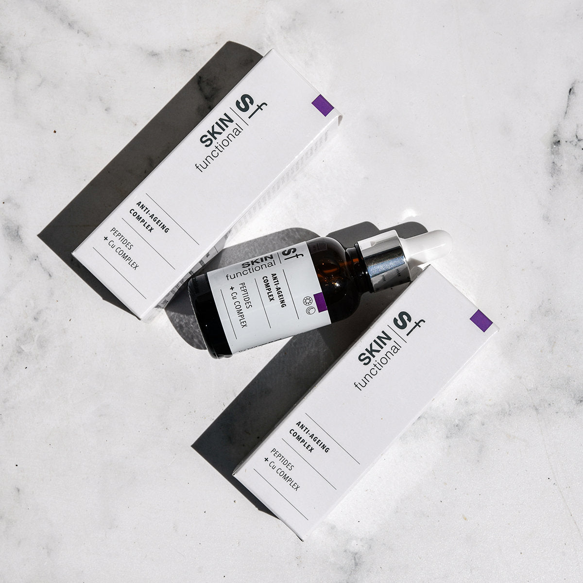 SKIN Functional anti-ageing complex treatment with details skincare product on a grey background